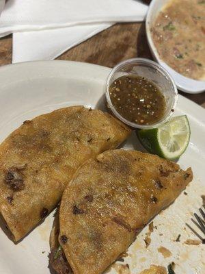 Quesabirria tacos with fresh tomatillo salsa