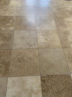 Tile left cloudy as you can see on the top of the picture. When we mop and it has dried it shines way more.