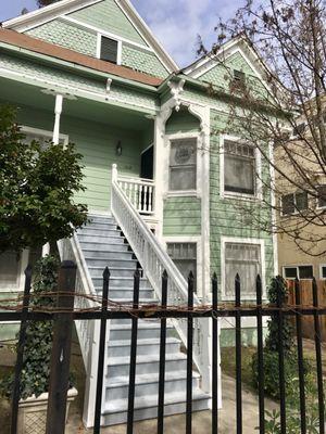 Freshly painted house and wrought iron gate.