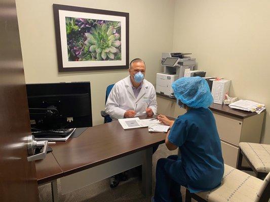 Dr. Coffler consulting with an Embryologist.