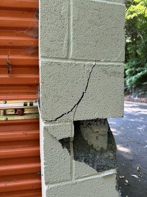 Shifting exterior brick of the brick. Located in the rear of second storage unit property.