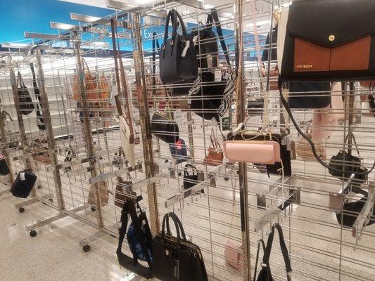 Near empty purse rack.... Smdh!