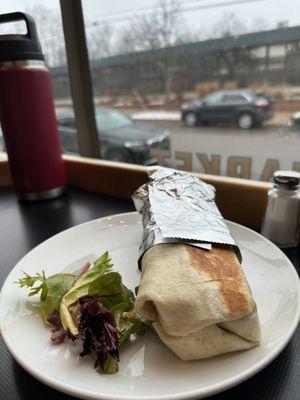 Breakfast Burrito - Grilled flour tortilla filled with scrambled Grazing Fields eggs, jack cheese, black beans with onions and pepper.