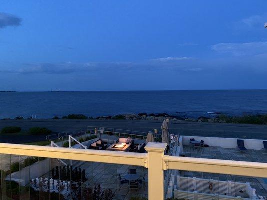 View of fire pit from balcony at night