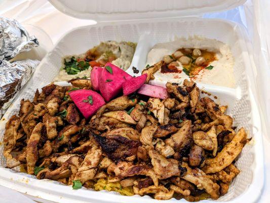 Chicken Shawarma (center). Baba ghanoush (left). Hummus (right)