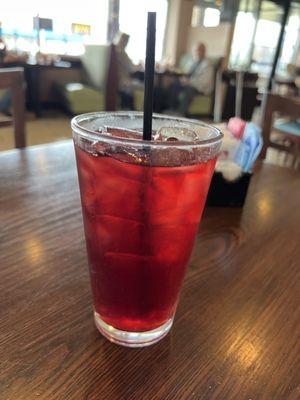 A refreshing glass of raspberry iced tea