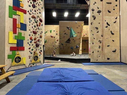 View of the silk's mats, top-rope walls, and part of the bouldering area.