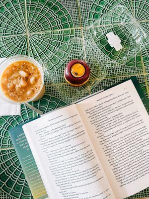 Caramel macchiato over ice. Pastry with honey, and a perfect spot to read