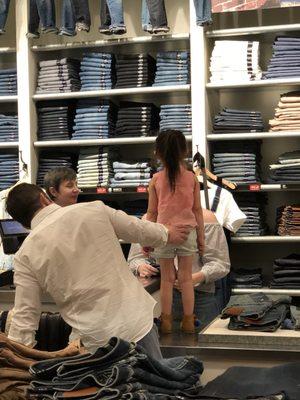 This is how you buy jeans. Stand on top of the counter being cute.