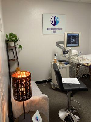 Ultrasound room with ultrasound machine and patient table