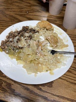 Pork chop special over rice - black eyed peas and boiled cabbage.  The jalapeño cornbread is gone already.