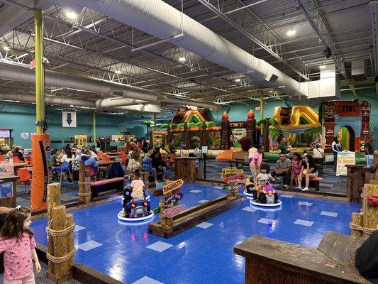 Main floor w/ electric atv's, dining area, bounce houses, etc