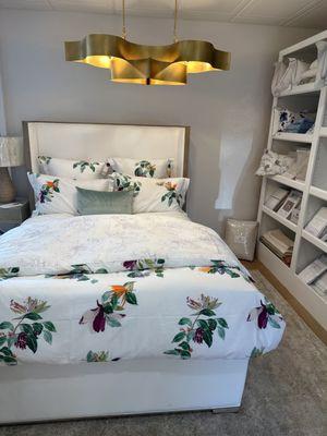 Another bed in the store with beautiful bedding!