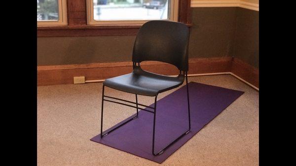 Using chairs as props to help clients get a deeper stretch.