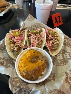 Street tacos, pork, pineapple salsa, pickled cabbage, jalapeño's