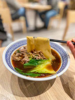 Wide noodles in braised beef brisket noodle soup