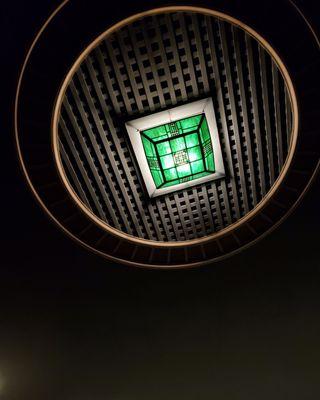 Inside the theater,  gazing up at the ceiling.