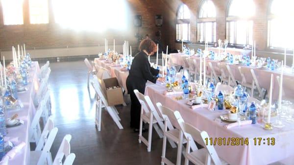 Placing the floral centerpieces by Lynkzstudio at South Shore Pavilion