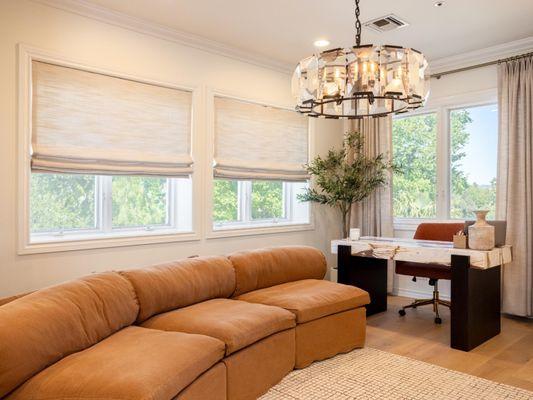 Enhance your home office with our elegant Roman shades and drapery. Match your aesthetic, reduce glare, and creative a produc...