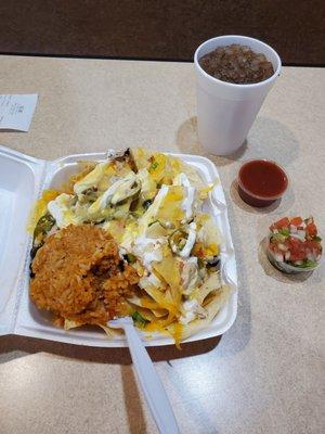 Shredded chicken nachos supreme--fresh condiments--mild sauce for me & salsa Fresca too!