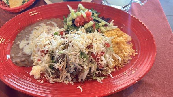 Tacos desebrados rice beans and a salad.