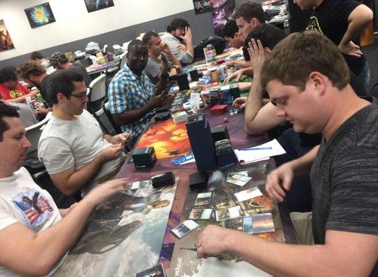 Playing Magic the Gathering at our weekly Friday Night Magic Drafts!