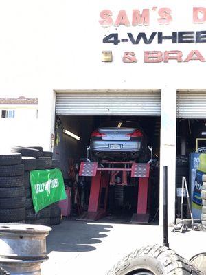 2010 Infiniti G37 Sport sedan getting tire replacement and wheel alignment.