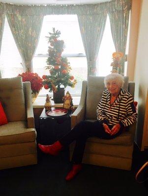 My 92 year old mom in her room at El Jen showing off her lovely Christmas decorations.