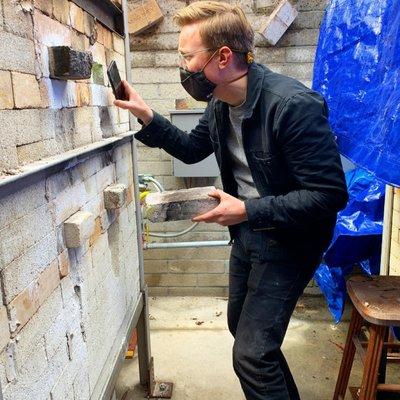 Nathan checking temps during a soda firing