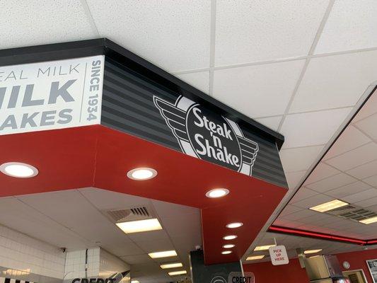 Steak and shake logo above the counter!