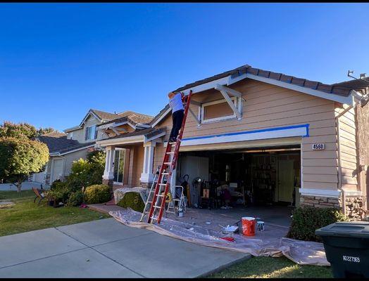 Painting the rafters.