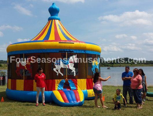 Inflatable Bouncy House Rentals in Chicago IL!  Merry Go Round Moonwalk for rent at your next event!!