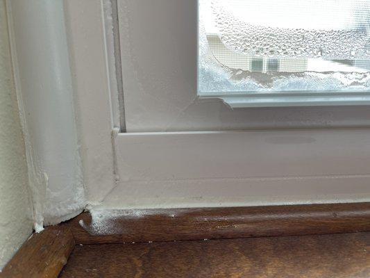 Frost penetrating through the sill up the window