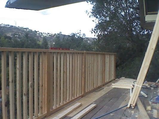 deck repair and new railing inclosure redesigned and built on sight