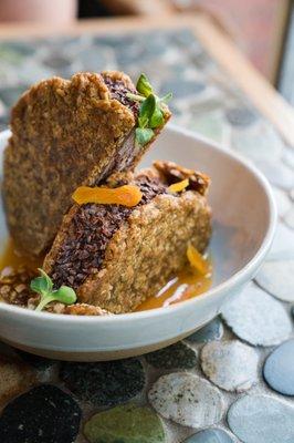 Sunflower butter ice cream sandwich with chocolate ice cream, sunflower brittle and apricot