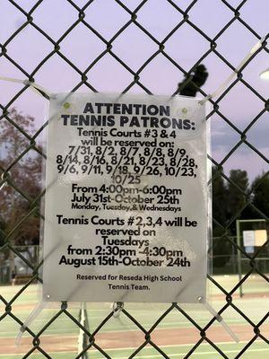 Tennis Court signage regarding reserved courts