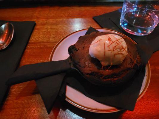 Chocolate chip cookie with peppers, cherries, and ice cream on top