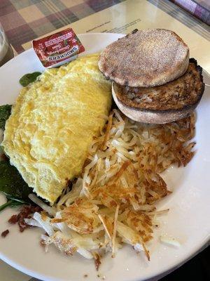 Spinach bacon Swiss omelette with hash and English muffin