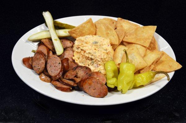 Sausage & Cheese - green onion infused sausage, homemade pimento cheese with house made chips, pepperoncini, peppers & pickles