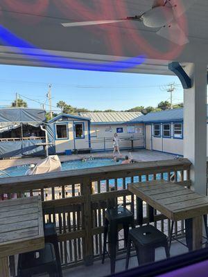 A pool in the center of the businesses! Looking outside the window from the brewery.