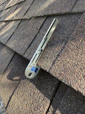 We use roof tools and facts when working with our clients. (HAGG Shingle Gauge)