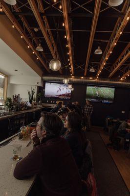 The bar area, facing the beautiful mountain landscape. Watch your friends and family ski and ride down the mountain!