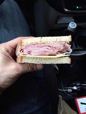 It's a ham and cheese on rye! Eating in a truck.