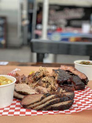 Brisket, ribs, pork plate with greens and corn