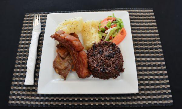 Fried Pork, congri rice, Garlic yuca and salad