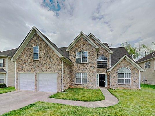 This spacious, stone front, 5 bedroom home has so much to offer! Beautiful 2 story foyer opens up with a grand entrance.