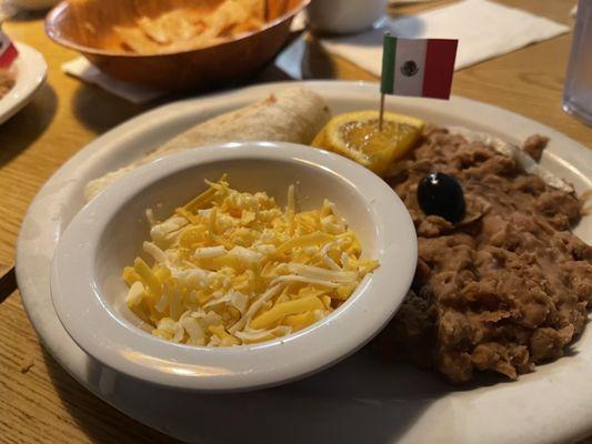 Kids plate. Beans with a pork taco.