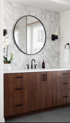 Modern look w/ Marble Mosaic backsplash. Compliment it with a Carrara white quartz prefab w/ a modern cabinet. Absolutely stunning.