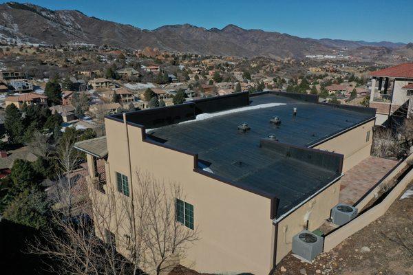 Removal of old modified bitumen roof and install of R-30 fully tapered insulation and fully adhered EPDM membrane & ne parapet cap metal.