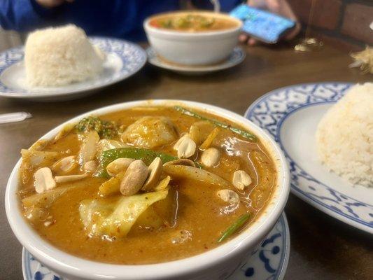 Massaman Curry with veggies pictures, front. Red curry with chicken, back.